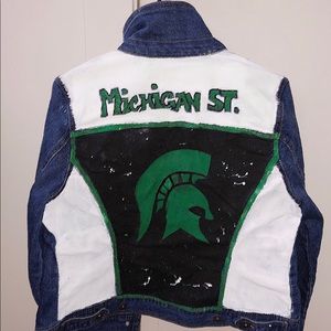 jean jacket with school design on background.